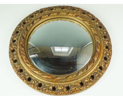 A vintage convex mirror in fancy gilt acanthus leaf frame, 43 cm
