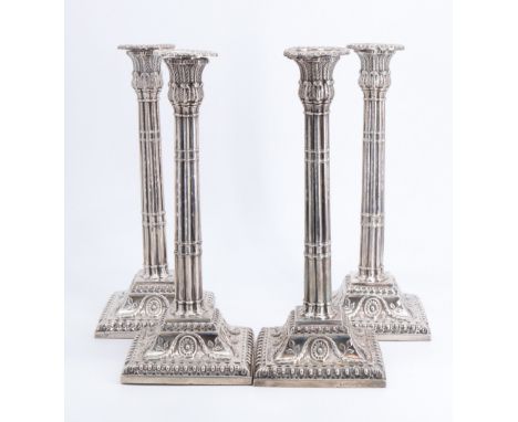 A set of four George III silver candlesticks, each having reeded columns with acanthus capitals and a detachable bobeche, the