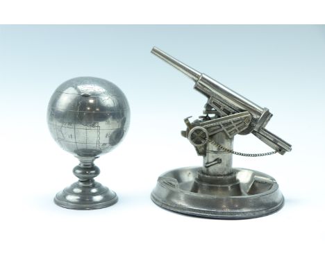 Two 1950s pewter novelty table lighters, being a petrol lighter in the form of an anti-aircraft gun, the body of the gun revo