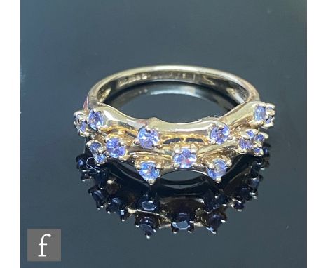 A 9ct hallmarked loliate ring, thirteen individually claw set stones to a three strand head, weight 3g, ring size N. 