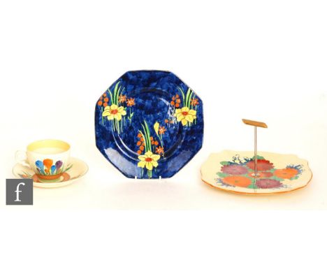 A Clarice Cliff Leda shaped plate circa 1930, hand painted in the Gayday pattern with radial flowers and foliage with orange 