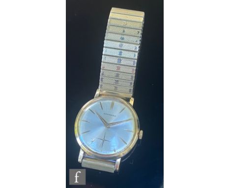 A gentleman's 9ct hallmarked Garrard wrist watch, batons and sweep second to a silvered dial, case diameter 32mm, all to a gi