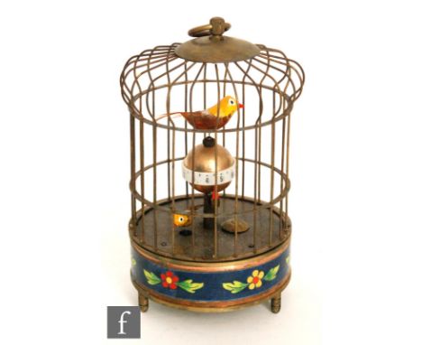 A mid 20th Century bird cage alarm clock, the brass cage with two birds that turn when wound and alarm rings, 20cm. 