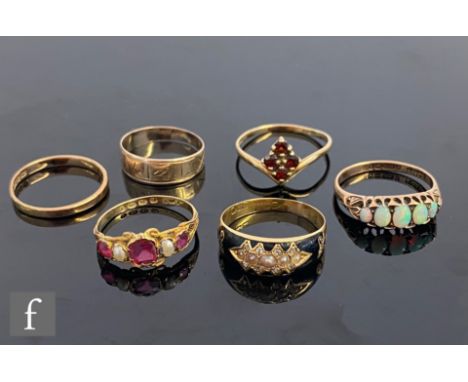 Six assorted rings to include an early 20th Century memorial, a five stone opal, a 12ct ruby and pearl five stone etc, total 