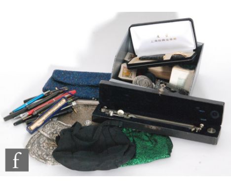 A collection of assorted fountain pens, propelling pencils, evening bags and a snuff box. (qty) 