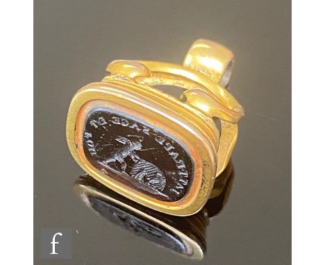 A 19th Century 9ct fob with intaglio carved black stone depicting a cherub pushing a wheel with Latin text above, length of c