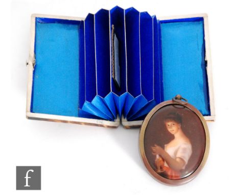 A 19th Century rectangular tortoiseshell card case opening to concertina interior, length 10cm, with a transfer printed oval 