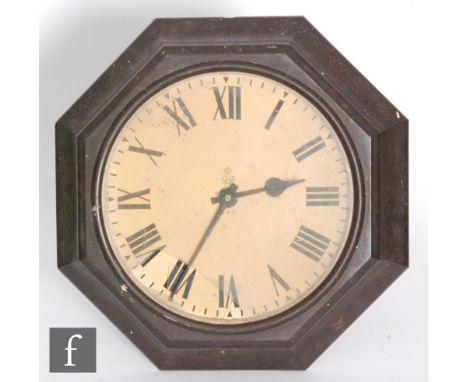 A George VI GPO brown Bakelite octagonal wall clock with Magenta impulse movement, width 44cm, S/D. 