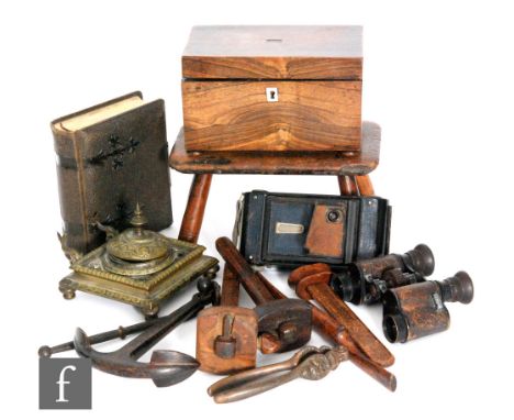 A small rustic oak four legged stool, width 22.5cm, a rosewood tea caddy, width 19cm, also a miniature iron anchor, a folding