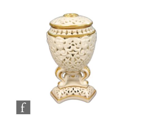 A late 19th Century Graingers Worcester reticulated pot pourri and cover, the reticulated egg shaped body with mask head deta