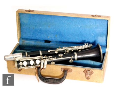 An early 20th Century French Couesnon Monopole clarinet in B flat, serial number 6540, with plated mounts, in a fitted case, 