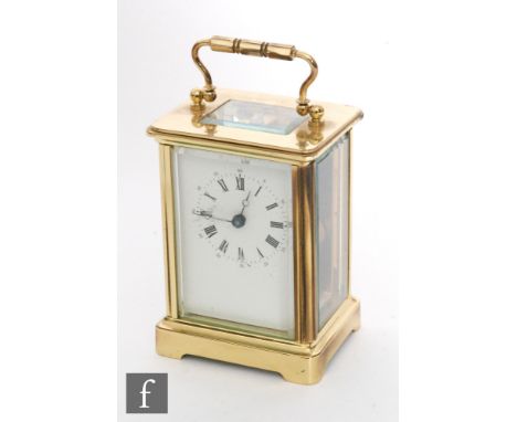 An early 20th century French brass carriage clock, white enamelled dial, on bracket plinth, height 11cm. 