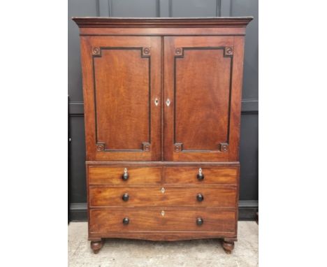 A George IV mahogany linen press, labelled 'R Snowdon, Cabinet Maker &amp; Appraiser, Northallerton', with ivory escutcheons,