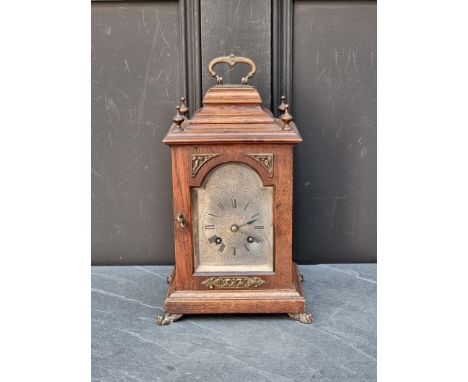A small 18th century style mantel clock,&nbsp;height including handle 30.5cm, with winding key. 