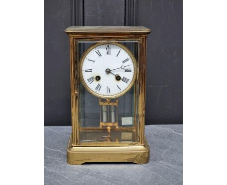 An antique brass four glass mantel clock, with mercury pendulum, 25cm high, (s.d. to dial).&nbsp; 