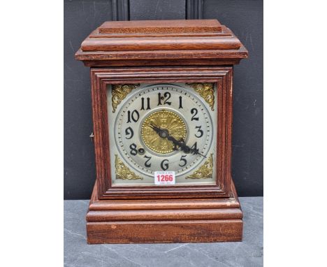 An old stained oak mantel clock,&nbsp;33cm high, with pendulum. 