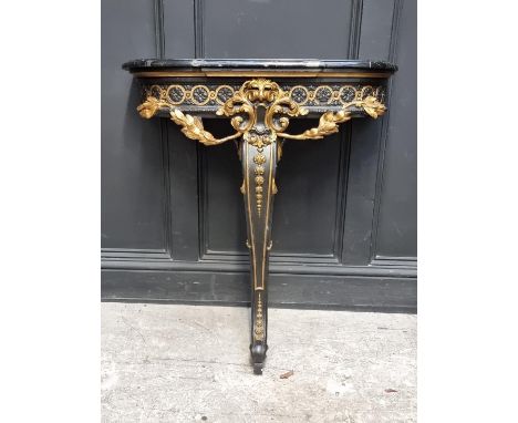 A neo-classical style ebonized, parcel gilt and marble top console table, 78.5cm wide. 