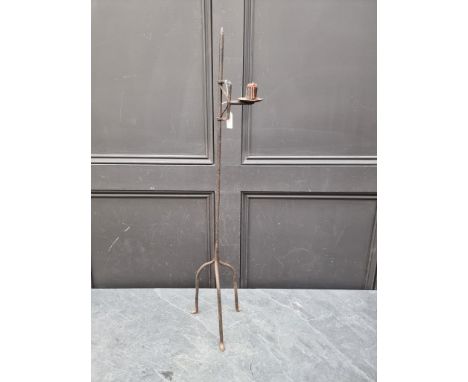 An antique wrought iron tripod candle stick,&nbsp;85cm high. 