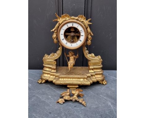 A gilt spelter mantel clock,&nbsp;31cm high, with figural pendulum, (pediment detached). 