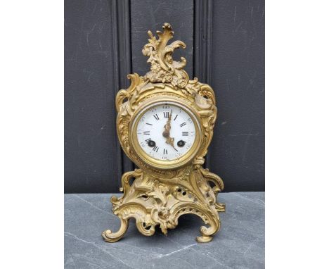 A Louis XV style gilt brass rococo mantel clock, 29.5cm high.&nbsp; 