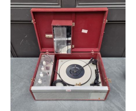 A vintage Clarendon TCRS9 portable record player,&nbsp;with detachable radio. 