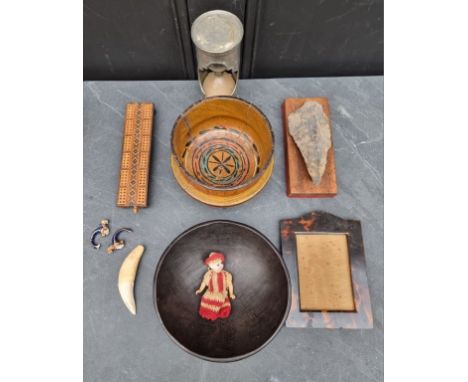 A mixed lot,&nbsp;to include a tortoiseshell frame, rebate 13.5 x 19.5cm; and a Neolithic hand axe. 
