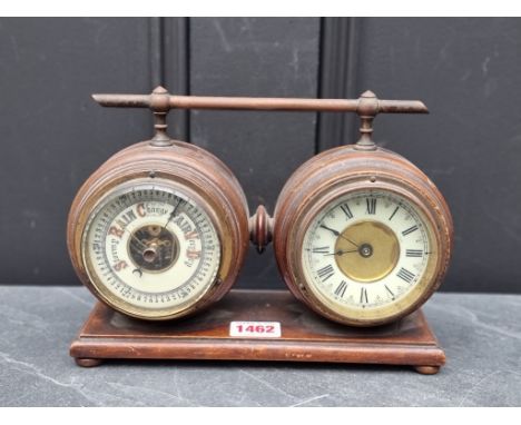 A late Victorian walnut combined clock and barometer set, with ivorine dials, 23.5cm wide. 