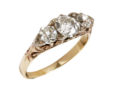 A Victorian three stone diamond ringclaw set with three graduated old round cut diamonds, diamond chip details, to a yellow m