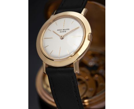 A gentleman's 18ct gold wristwatch, Patek PhilippeCalatrava, broad bezel champagne dial, baton numerals, inscribed Patek Phil