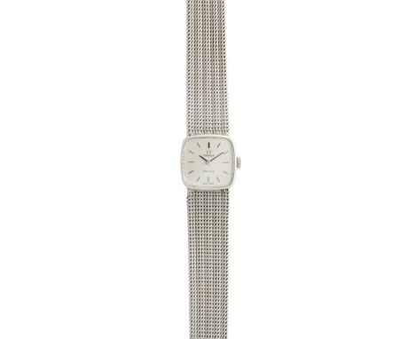 A lady's 9ct white gold wrist watch, OmegaGenève, the squared silver dial with baton numerals, integral woven link bracelet, 