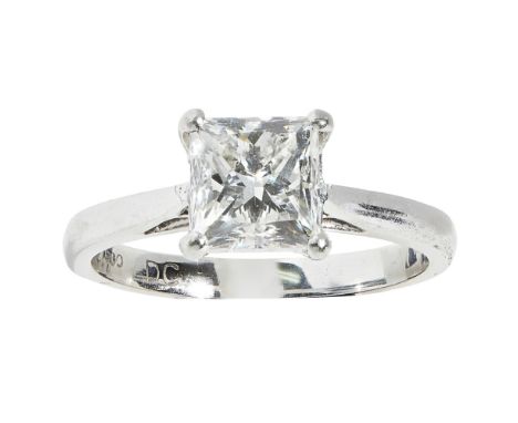 A single stone diamond ringclaw set with a single princess cut diamond, to a plain white metal shank stamped PT900; with acco