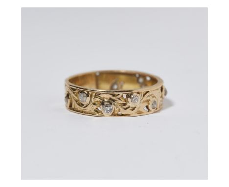 A modern diamond set ringwith pierced foliate detail throughout, set at intervals with small old round cut diamonds, unmarked