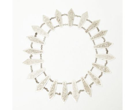 A Chinese silver necklacecomposed of twenty tapering panels, with embossed foliate, pastoral scene or Chinese character mark 