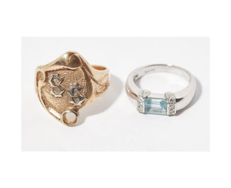A contemporary aquamarine and diamond set ringset with a trap cut aquamarine, the shoulders set with small round brilliant cu