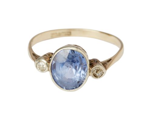 A sapphire and diamond set three stone ringmillegrain set with an oval cut sapphire, flanked by two small old round cut diamo