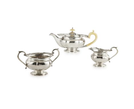 A matched three piece tea serviceWalker & Hall, Sheffield 1933 and 1935, comprising teapot, twin handled sugar bowl and milk 