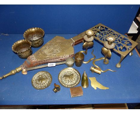 A quantity of brass to include; two jardinieres, two small plates with Oriental design, a pair of Cobra candlesticks, brass b