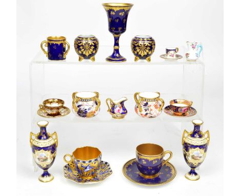 15 pieces of miniature porcelain to include a pair of miniature Coalport 304606 cream and blue vases initialled RH, pair of C