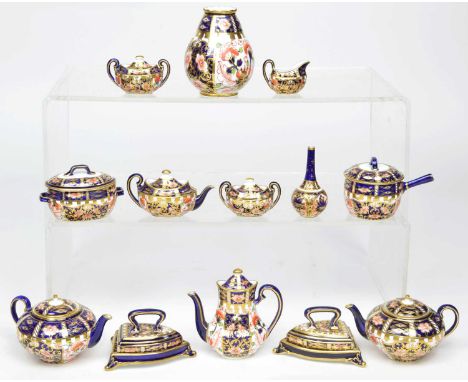 13 items of miniature Royal Crown Derby 6922 pattern imari to include a pair of flat iron on stand dated 1920 and 1912, a lon