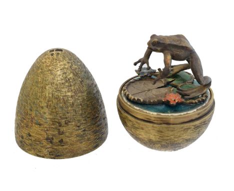 A silver gilt and enamel surprise egg by Stuart Devlin, the textured silver gilt egg opening to reval a leaping frog with var