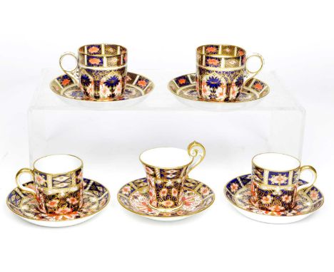 5 Royal Crown Derby demitasse coffee cups and saucers to include a pair of 1288 imari pattern cups and saucers dated 1933, a 