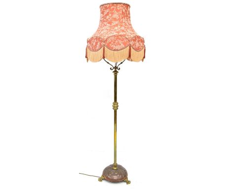Victorian floor standing oil lamp, now converted to electricity with later fabric-covered shade, loaded circular base with em