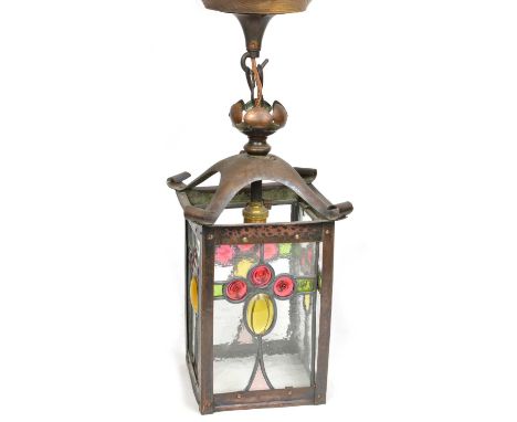Wrought and hammered Copper Arts &amp; Crafts lantern light fitting with four stained glass panels each with three red circle