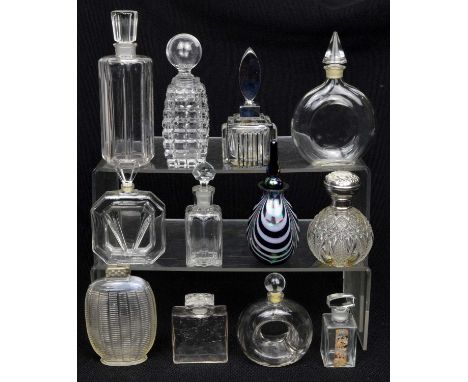 12 perfume bottles to include a Bijan doughnut shape bottle 10cm, an art deco style bottle 12cm, a square bottle with moulded