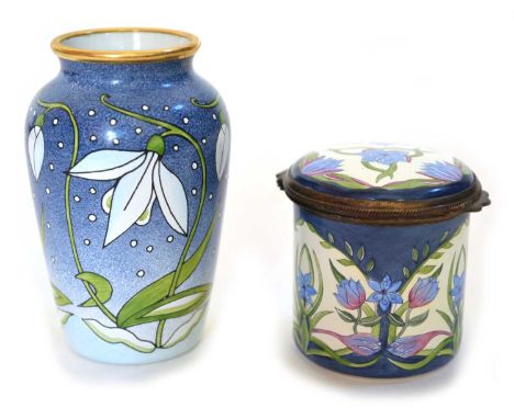 Two pieces of Moorcroft enamel to include a 'Snowdrop' design vase decorated with snowdrops on a mottled blue ground, designe