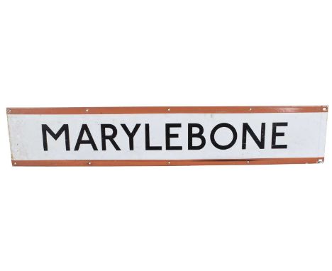 London Underground Enamel station sign for Marylebone, black text on white background with red top and bottom border, the bac