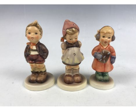 Three Hummel figures including Pretty Please, Carefree and Sweet Treats