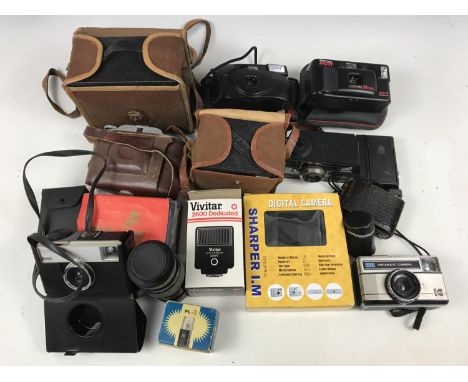 Vintage cameras, lenses and related equipment, including a Kodak No 2A Brownie, a Kodak Brownie Junior and a Synagor 1:4.5 f=