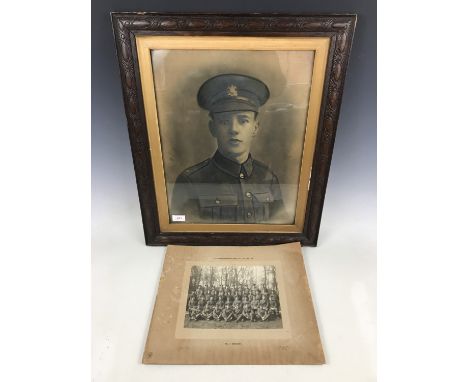 A framed First World War portrait photograph and a unit photograph