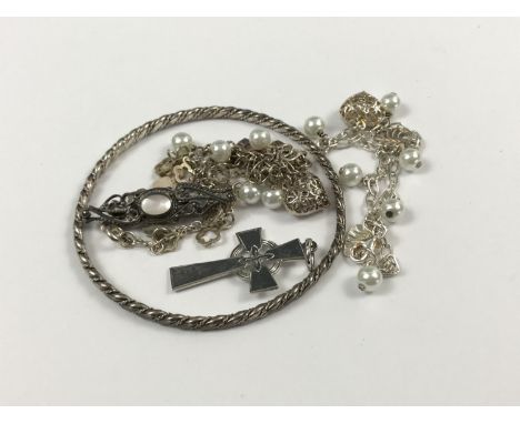 A silver bangle, Scottish silver pendant Celtic cross, a white metal and mother-of-pearl brooch, together with three white me